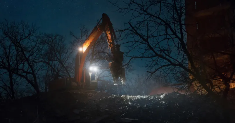 Grävmaskin i mörker