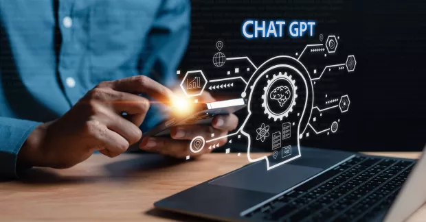 Illustration av en person som använder AI-teknologi på sin bärbara dator. 